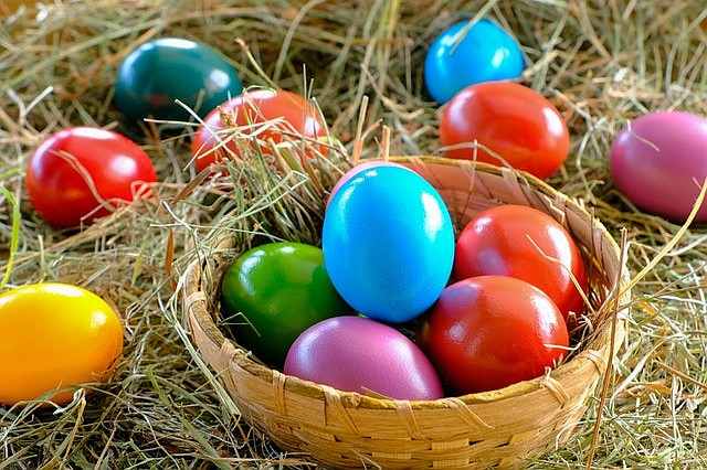 Red Blue Green and Yellow Eggs on Brown Woven Basket